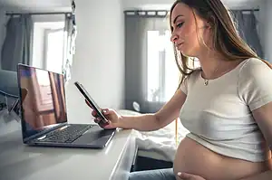 Digital pregnancy test showing a positive result